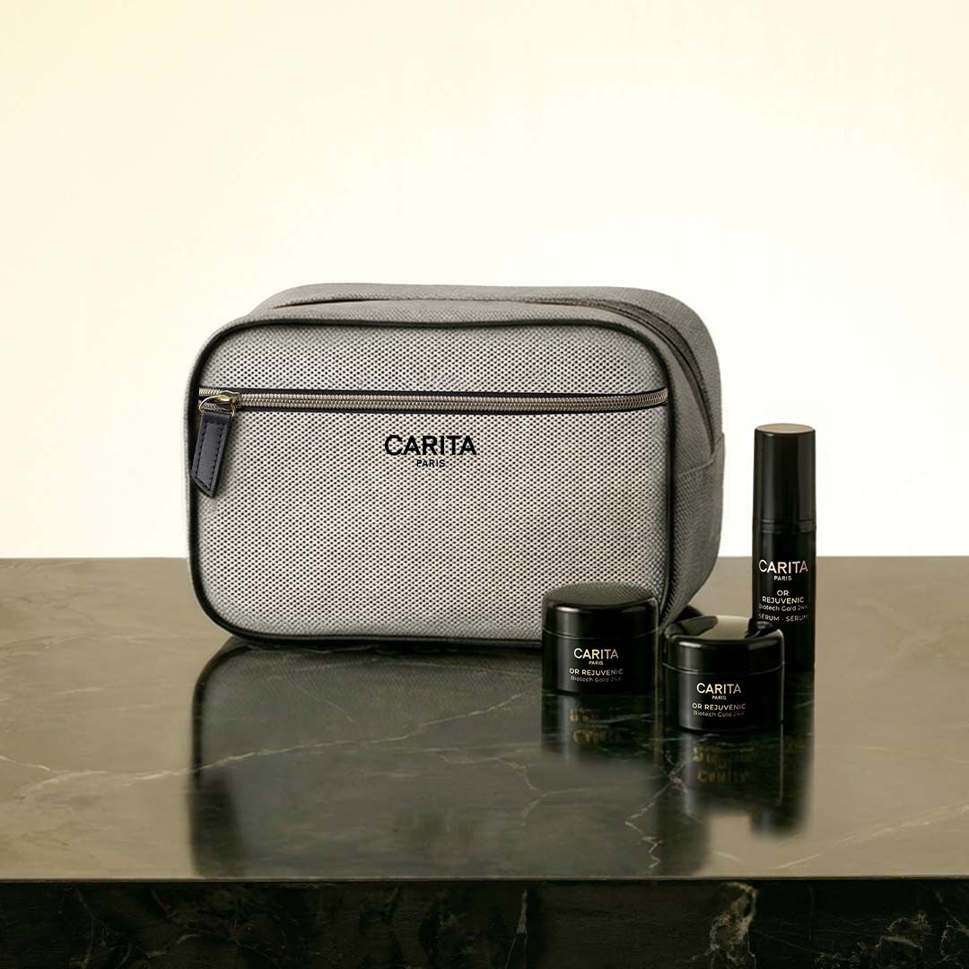 Borsa Carita e tre prodotti Or Rejuvenic in barattoli neri.​