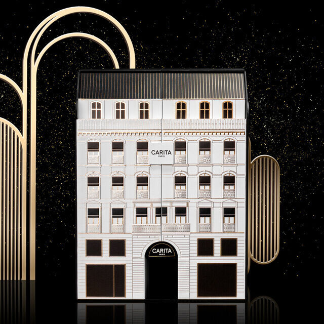 Immagine stilizzata di un edificio elegante con dettagli dorati su uno sfondo nero.
