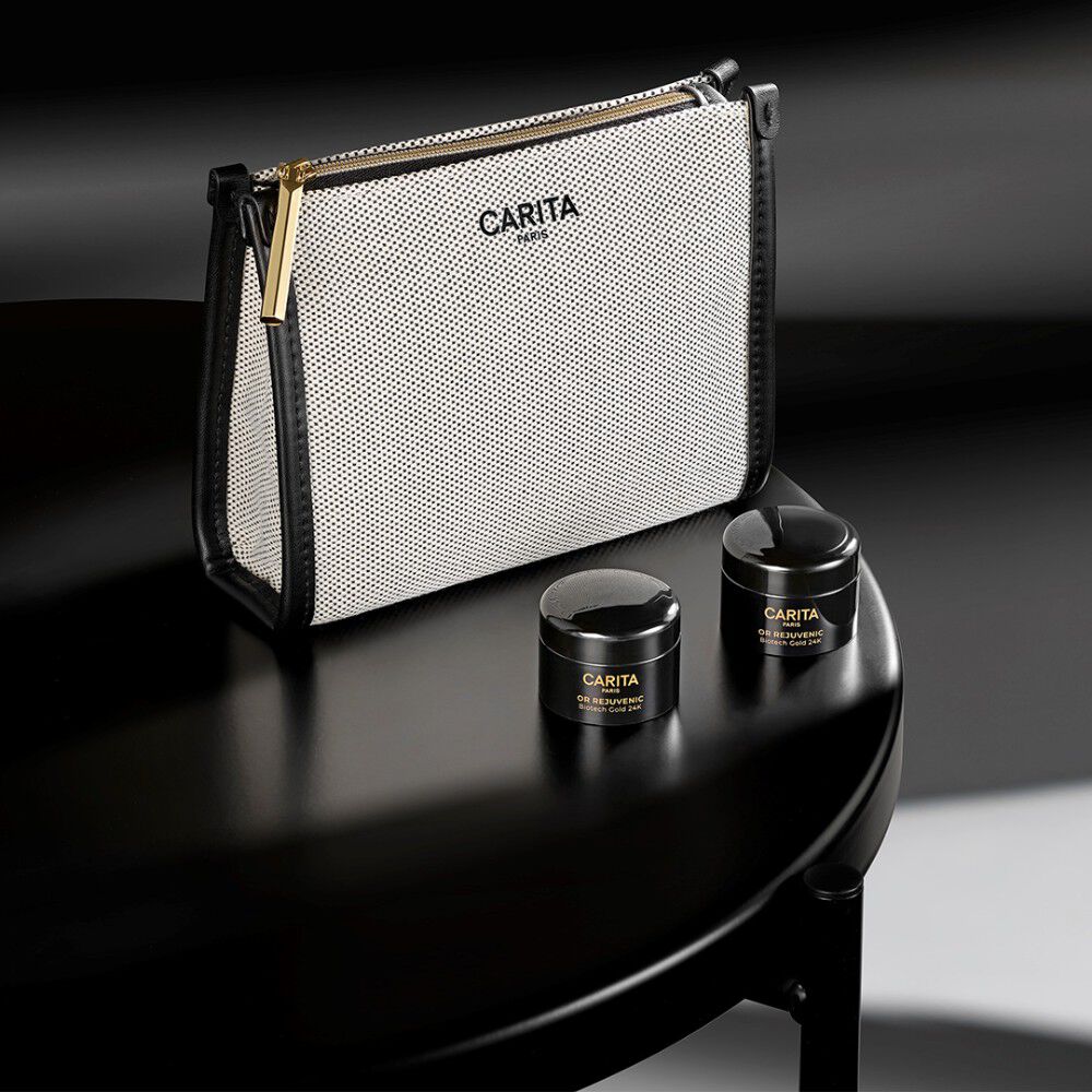 Borsa Carita e tre prodotti Or Rejuvenic in barattoli neri.​